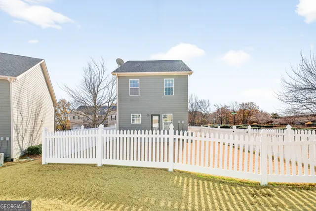 a front view of a house with yard