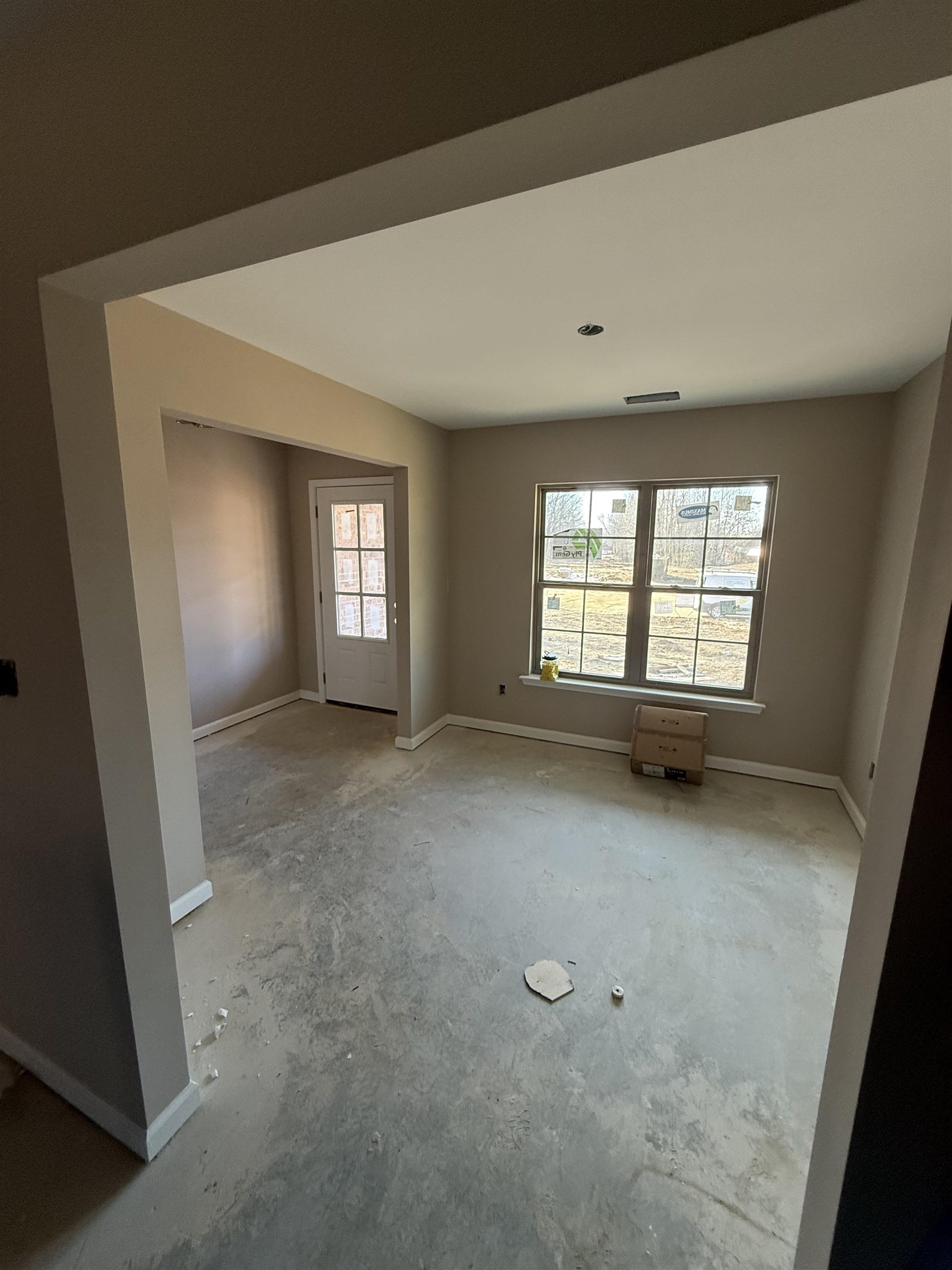 104 Stonebrook Ripley, TN 38063 - Photo 4 of 6 an empty room with windows