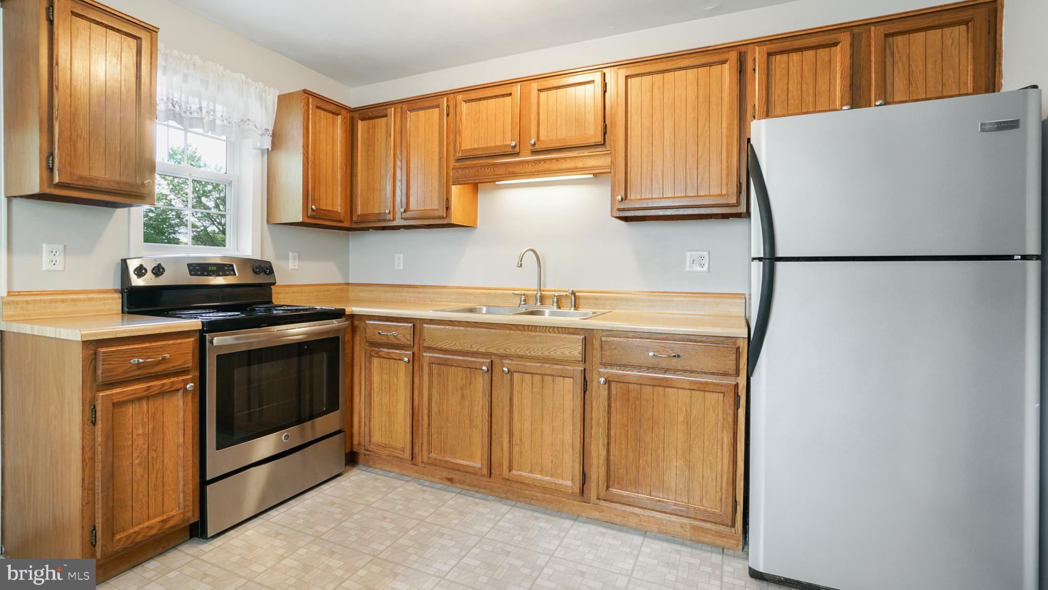 3316 Augusta Road Manchester, MD 21102 - Photo 2 of 38 Beautiful stainless stove and fridge in kitchen