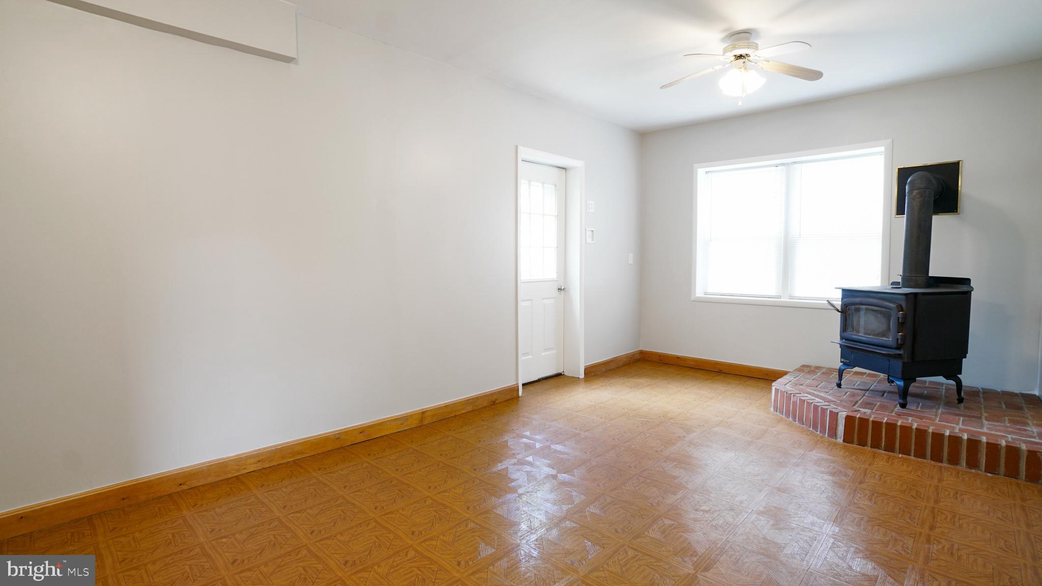3316 Augusta Road Manchester, MD 21102 - Photo 5 of 38 Lower Level family room w/ wood stove w/ catalytic