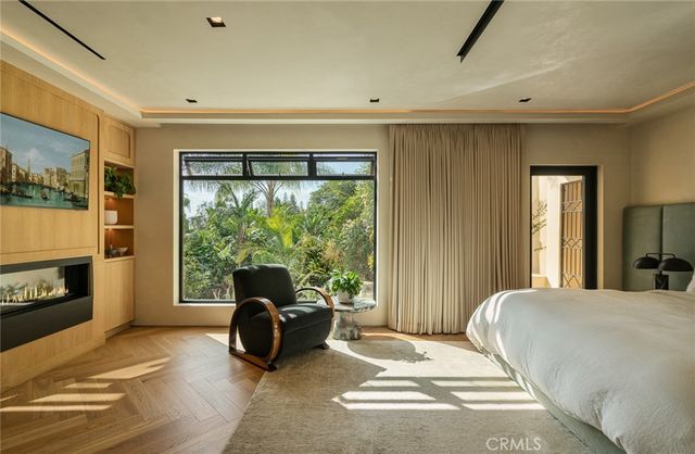 a bedroom with a bed and a fireplace