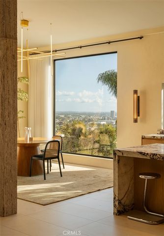a view of a balcony with table and chairs