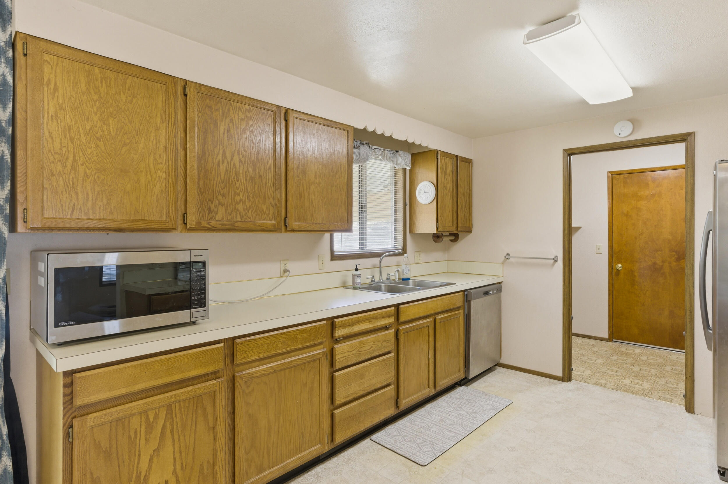 50868 Doe Loop La Pine, OR 97739 - Photo 13 of 51 a kitchen with a sink and cabinets