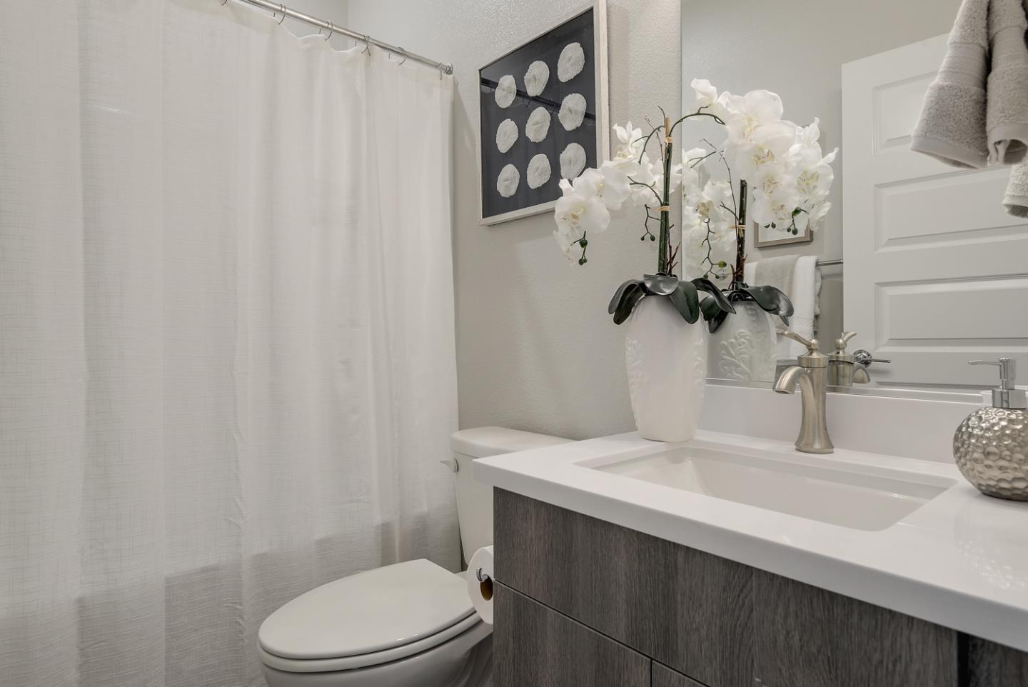 388 Circuit Way Mountain View, CA 94043 - Photo 20 of 26 a bathroom with a sink a toilet and a mirror