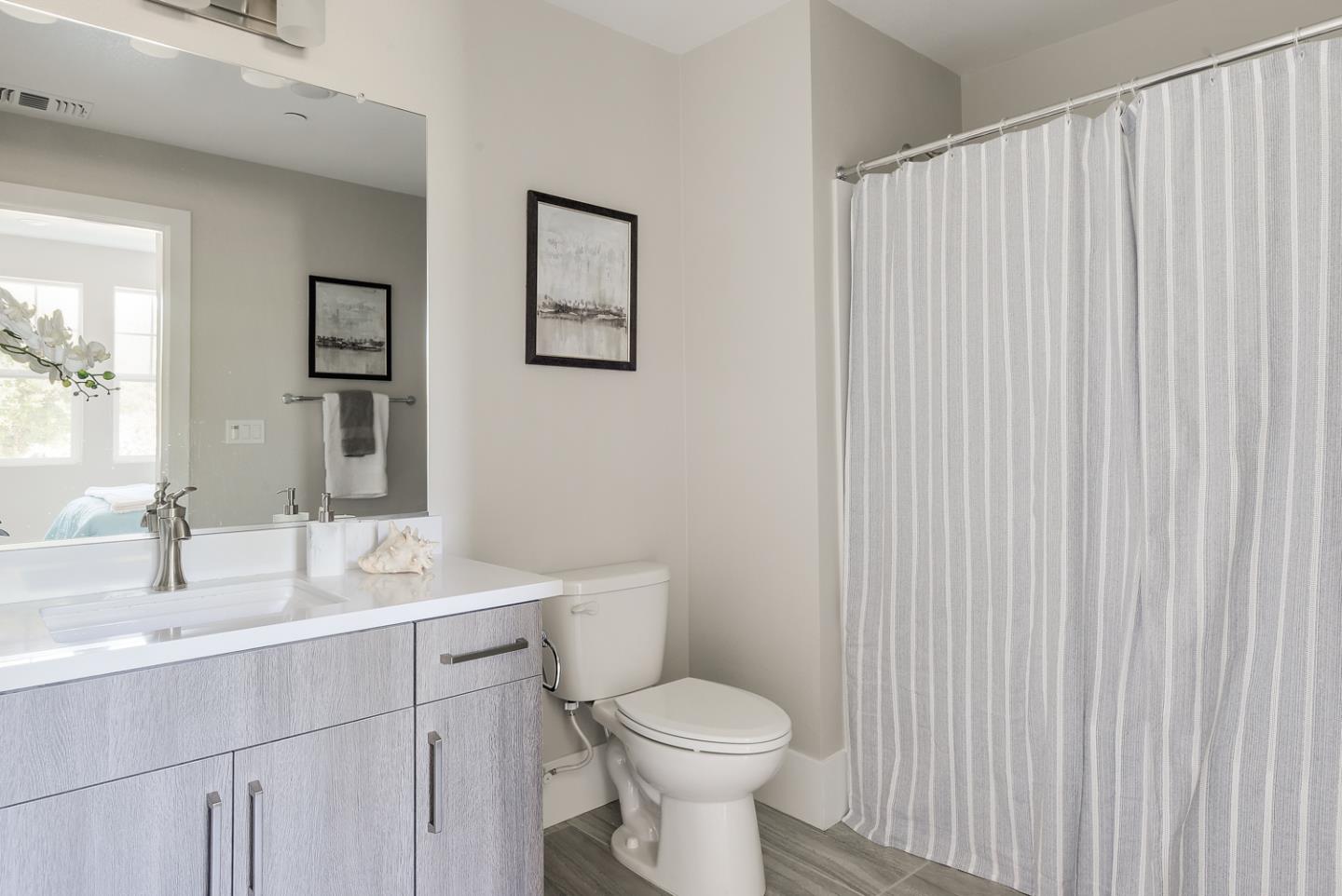 388 Circuit Way Mountain View, CA 94043 - Photo 26 of 26 a bathroom with a toilet sink vanity and mirror