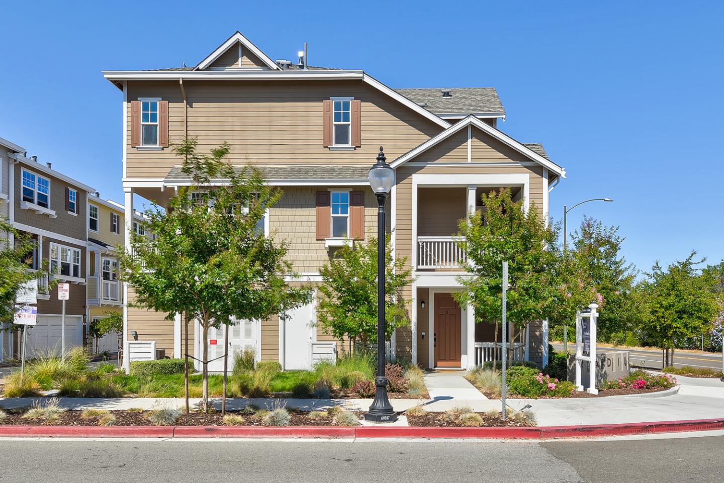 388 Circuit Way Mountain View, CA 94043 - Photo 4 of 26 a front view of a house with a yard and potted plants