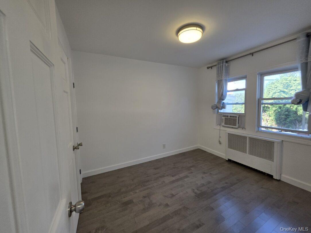 30 Aberdeen Road New Hyde Park, NY 11040 - Photo 37 of 37 wooden floor in an empty room with a window