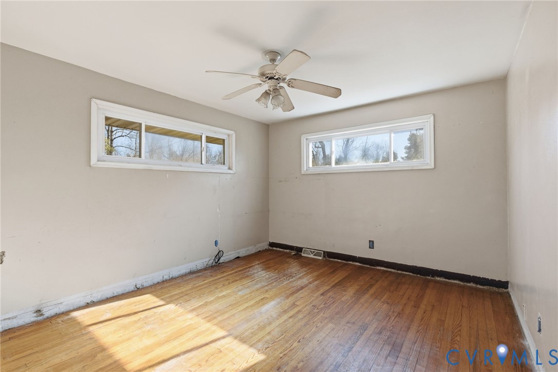 6106 Lewis Road Petersburg, VA 23803 - Photo 12 of 29 a view of a room with wooden floor and window
