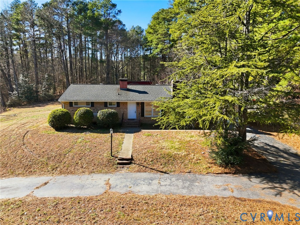 6106 Lewis Road Petersburg, VA 23803 - Photo 26 of 29 a table and chairs sitting in the middle of a yard