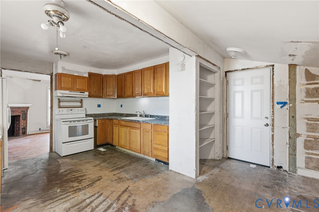 6106 Lewis Road Petersburg, VA 23803 - Photo 10 of 29 a kitchen with stainless steel appliances a refrigerator and a stove top oven