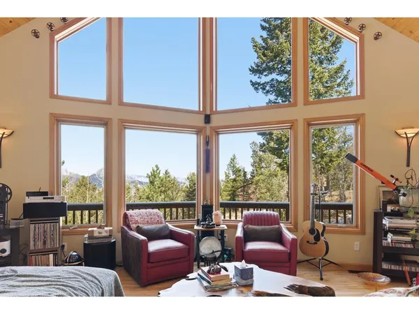 a living room with furniture fireplace and flat screen tv
