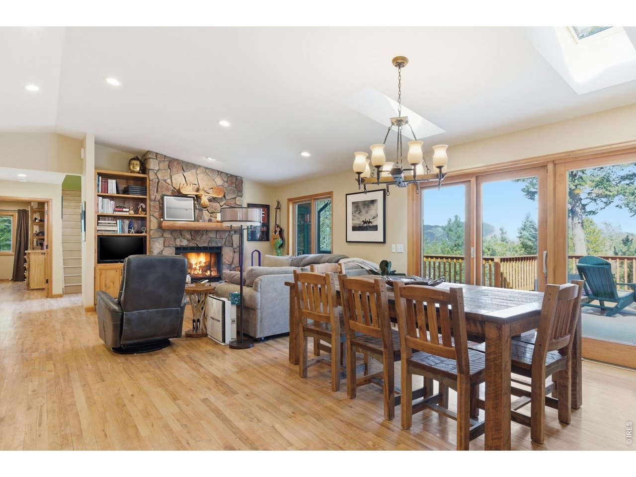 4079 Little Valley Road Estes Park, CO 80517 - Photo 17 of 39 a dining room with furniture window and wooden floor