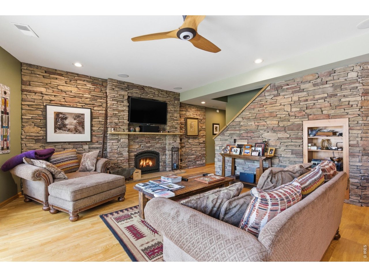 4079 Little Valley Road Estes Park, CO 80517 - Photo 25 of 39 a living room with fireplace furniture and a flat screen tv