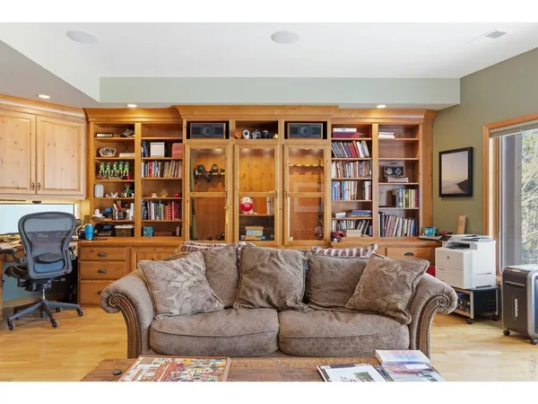 a bedroom with a bed with wooden floor