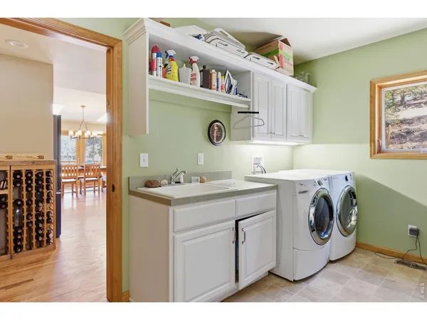 a kitchen with cabinets and window