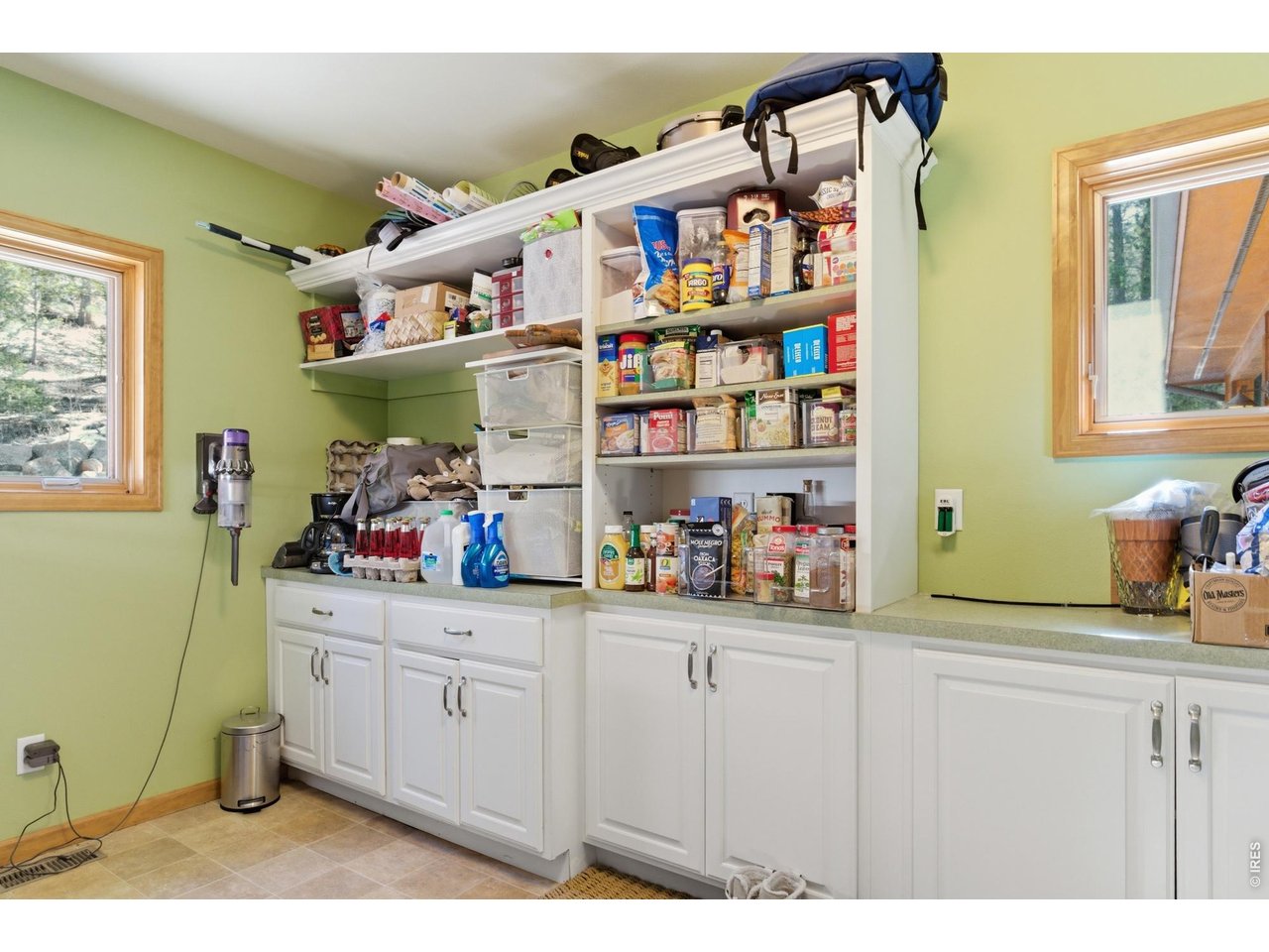 4079 Little Valley Road Estes Park, CO 80517 - Photo 32 of 39 a kitchen with cabinets and window