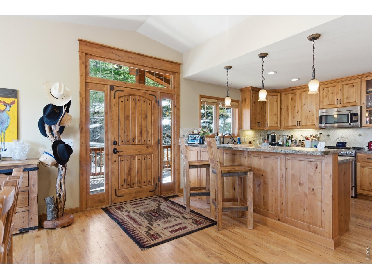 4079 Little Valley Road Estes Park, CO 80517 - Photo 6 of 39 a open kitchen with white cabinets and stainless steel appliances