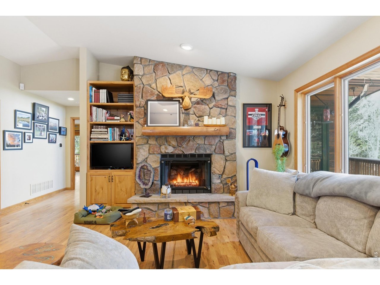 4079 Little Valley Road Estes Park, CO 80517 - Photo 9 of 39 a living room with furniture and a fireplace
