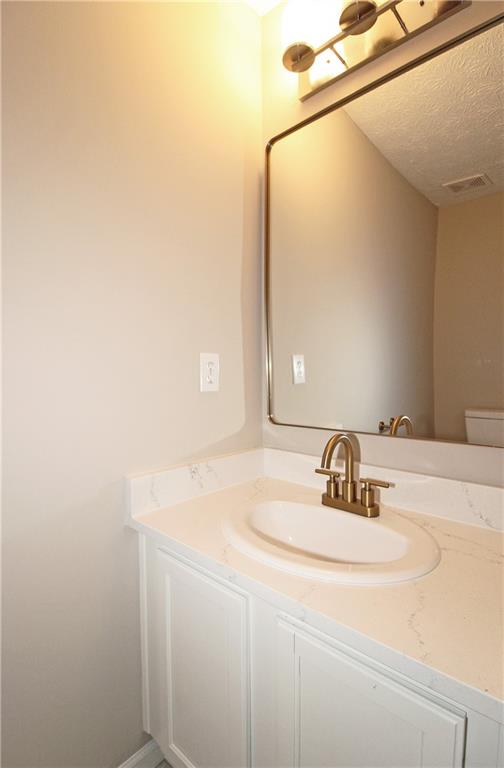 1334 Ambercrest Way Austell, GA 30168 - Photo 11 of 20 a bathroom with a sink and a mirror
