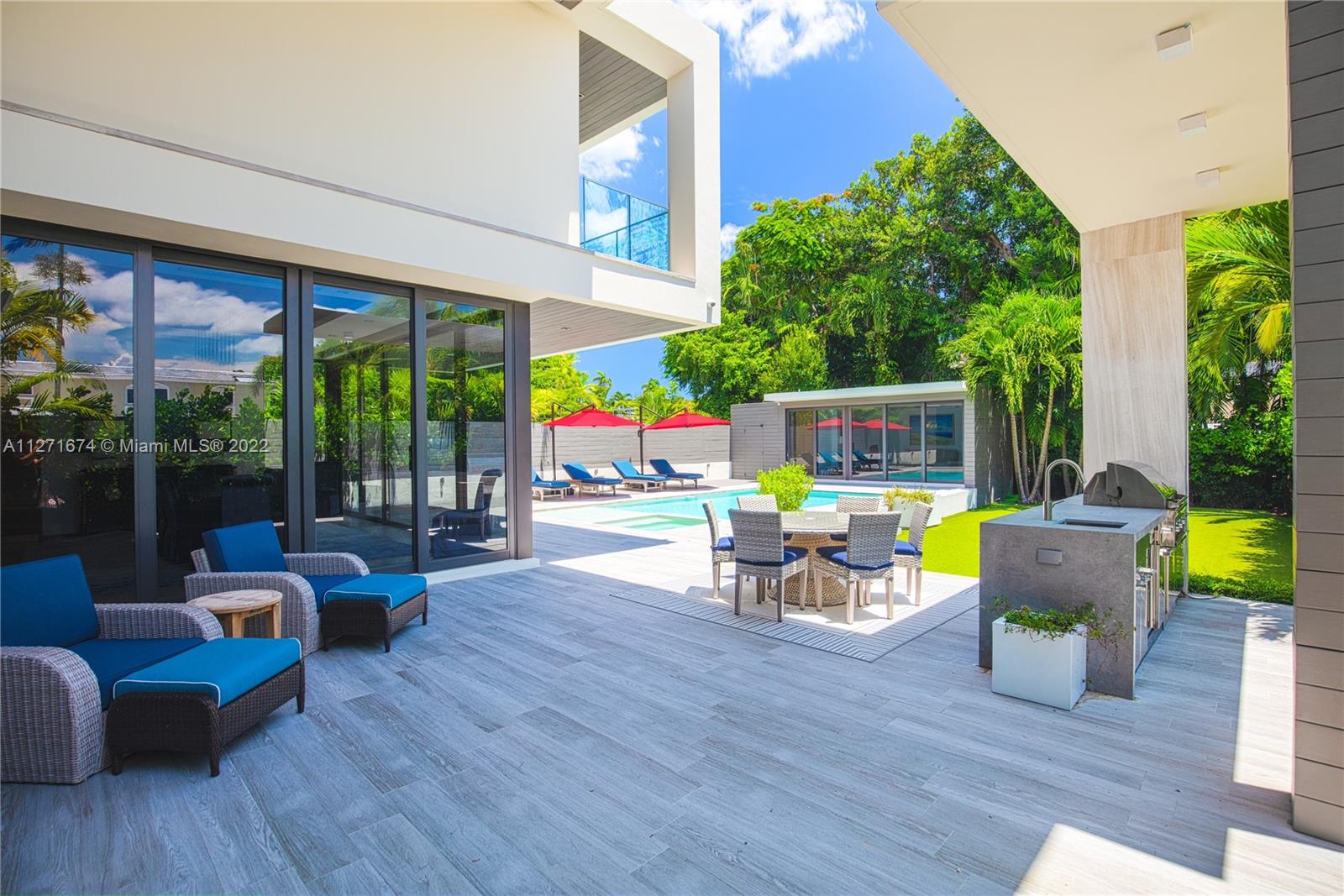 5061 North Bay Road Miami Beach, FL 33140 - Photo 11 of 23 a outdoor space with patio the couches and chairs with wooden floor