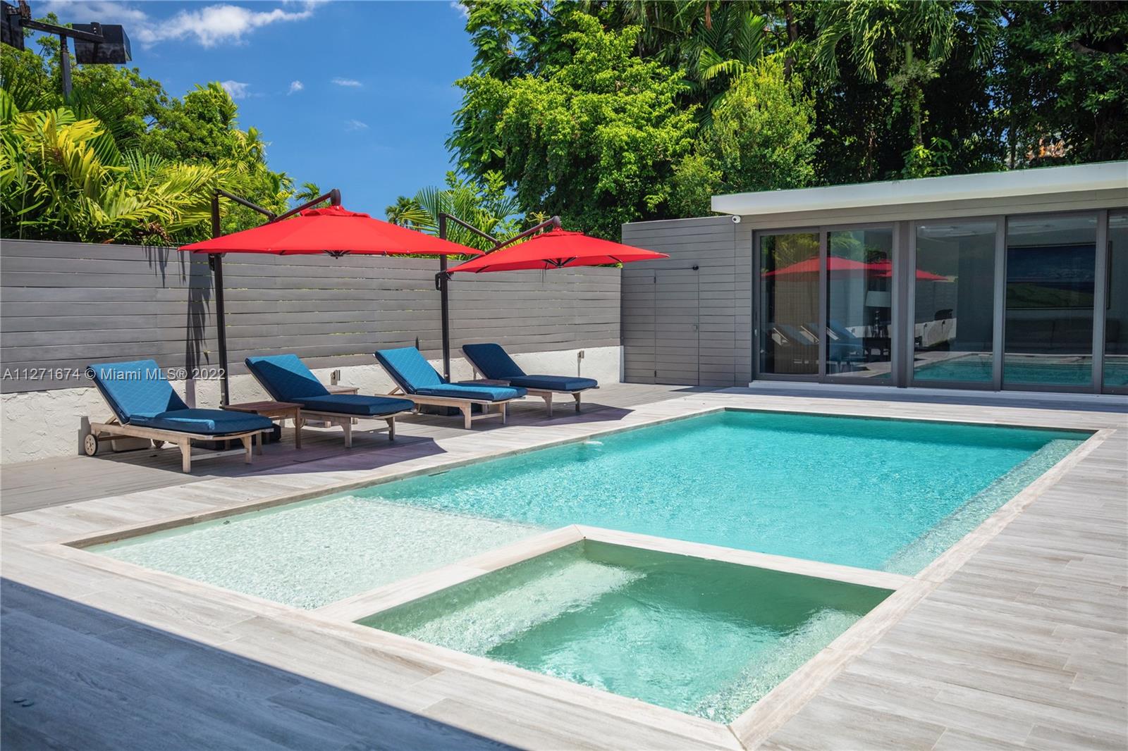 5061 North Bay Road Miami Beach, FL 33140 - Photo 12 of 23 a view of a backyard with sitting area