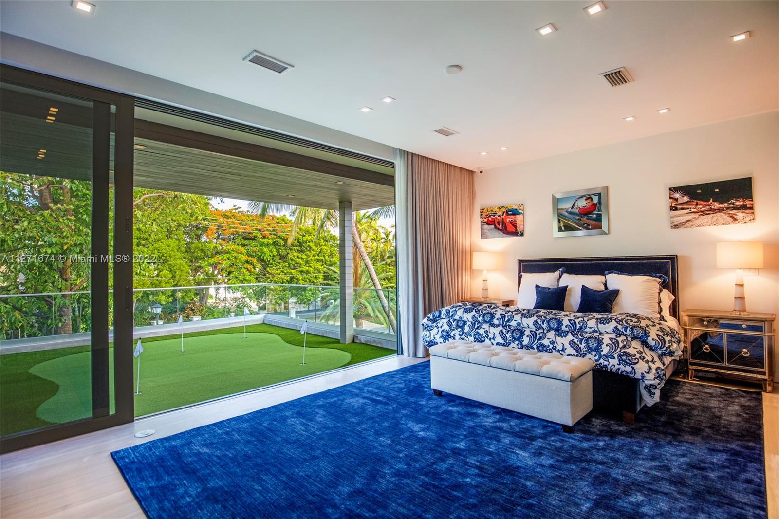 5061 North Bay Road Miami Beach, FL 33140 - Photo 14 of 23 a room with a bed and a view of bedroom