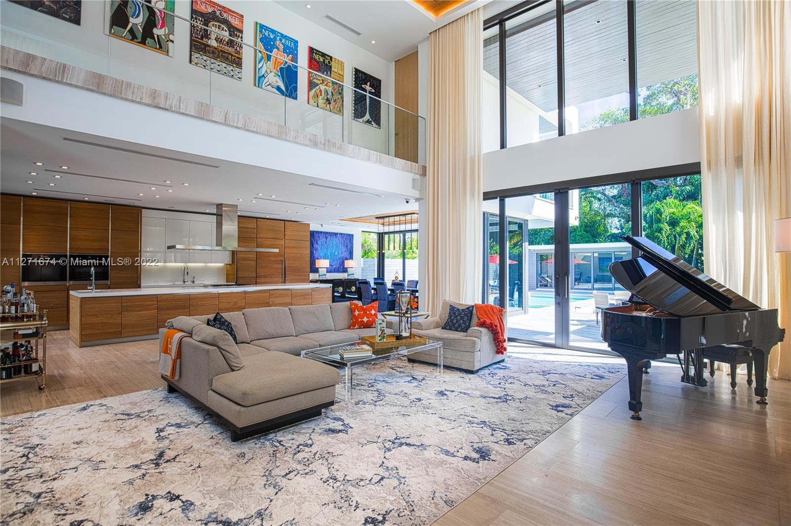 5061 North Bay Road Miami Beach, FL 33140 - Photo 3 of 23 a living room with furniture and a large window