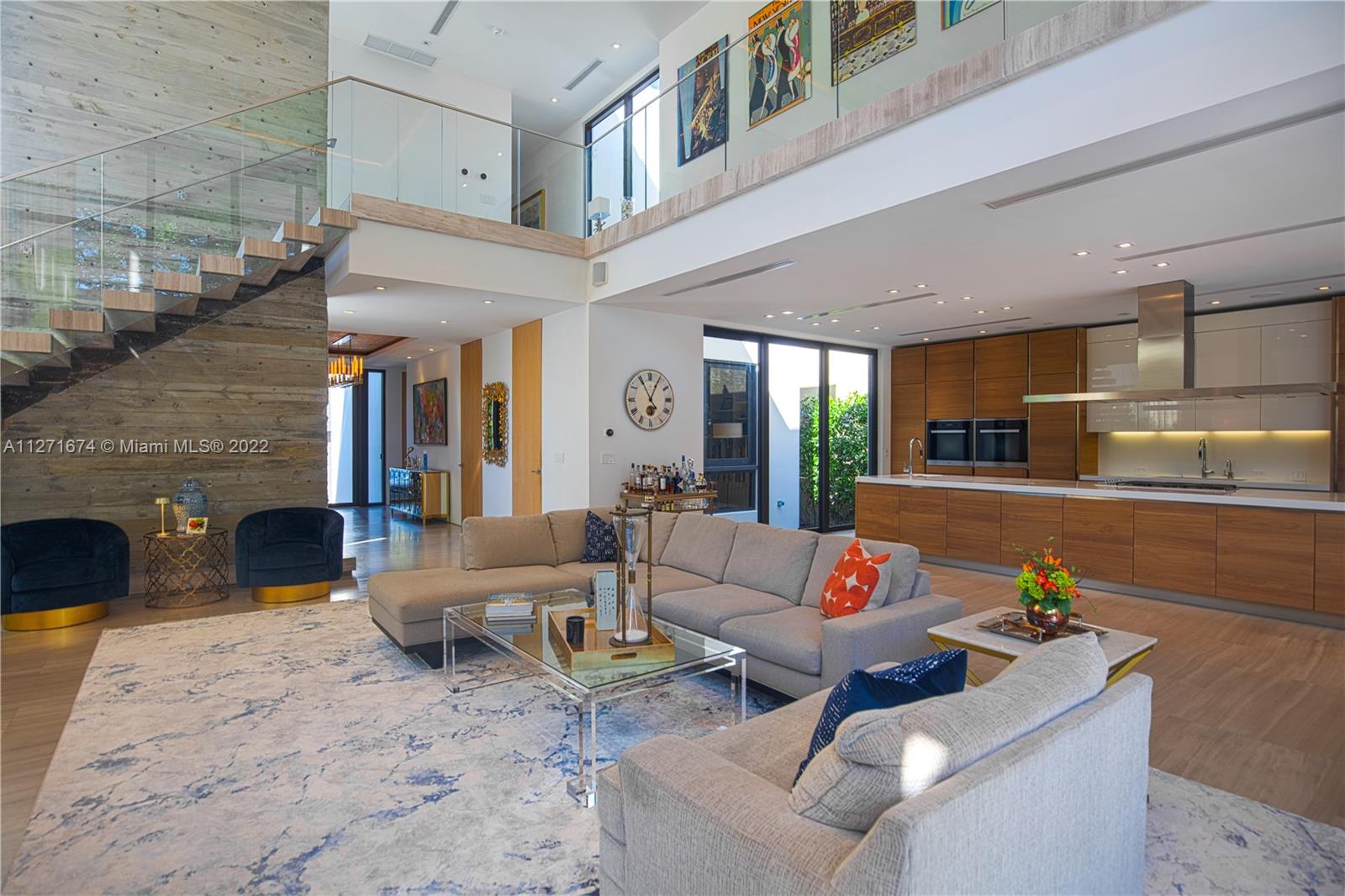 5061 North Bay Road Miami Beach, FL 33140 - Photo 10 of 23 a living room with furniture and a fireplace