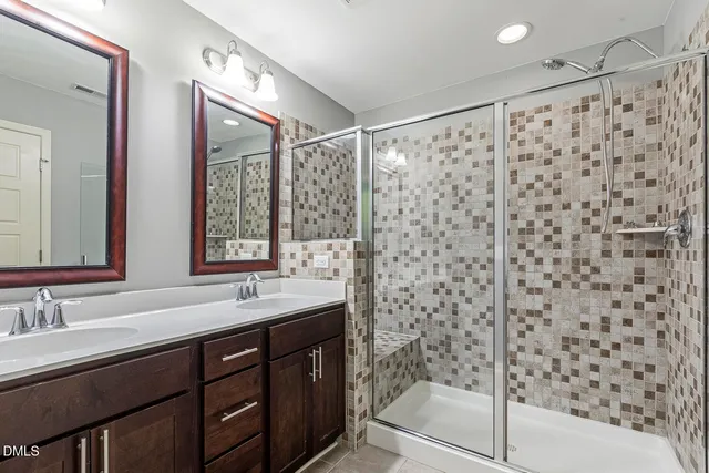 a bathroom with a shower and a sink