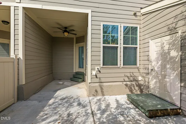 a view of swimming pool is middle in the middle of a garden