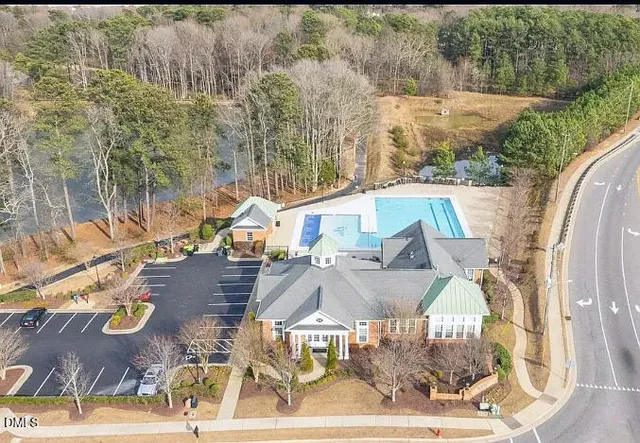 a view of river covered by trees and buildings