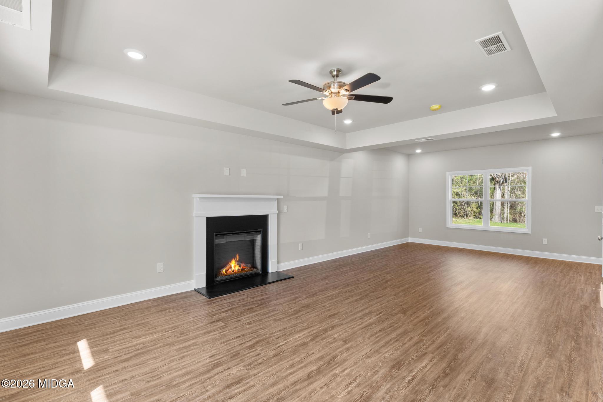 220 Welsh Trail Macon, GA 31216 - Photo 12 of 30 wooden floor in an empty room with a window
