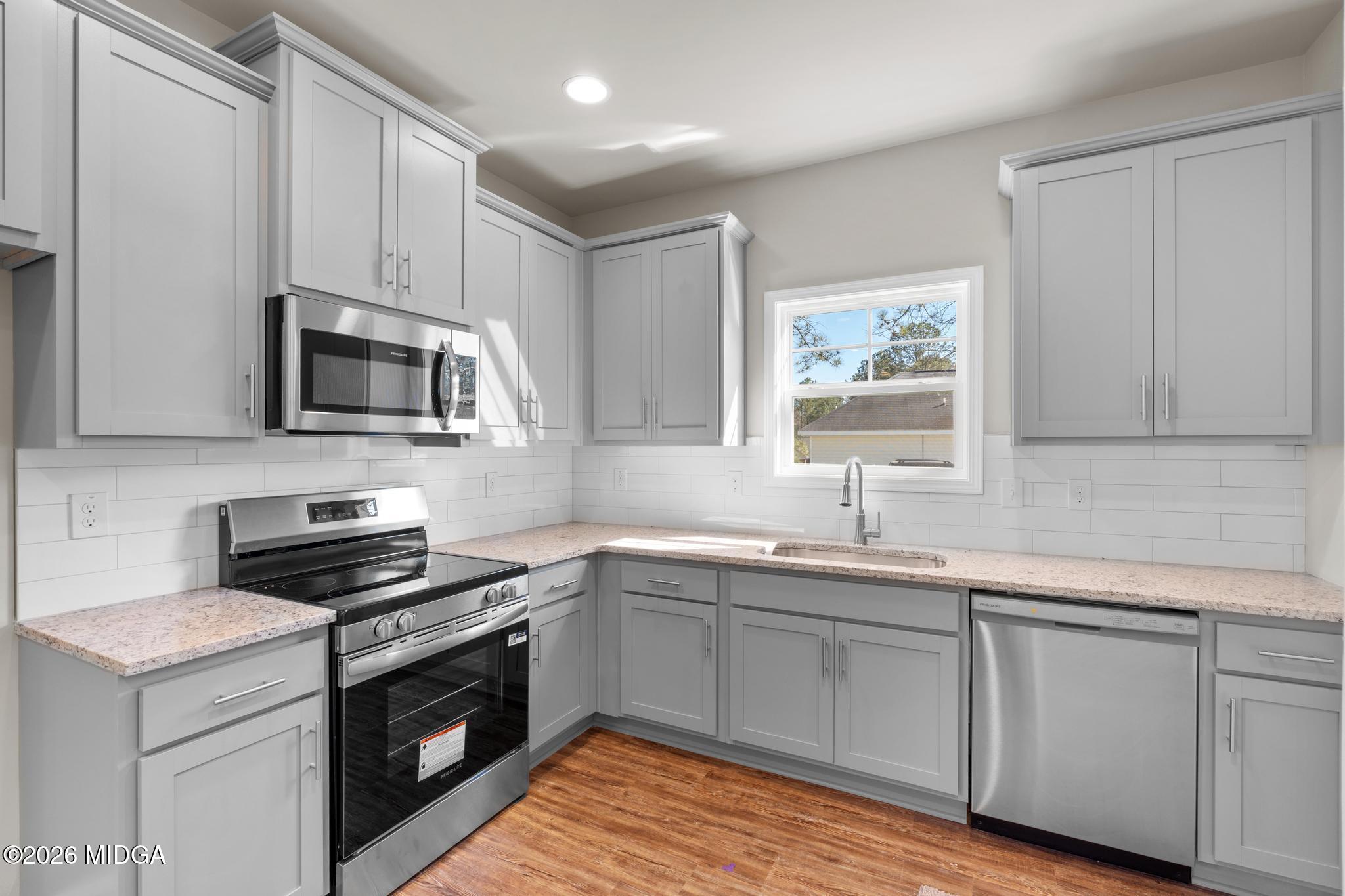 220 Welsh Trail Macon, GA 31216 - Photo 15 of 30 a kitchen with appliances cabinets and a sink