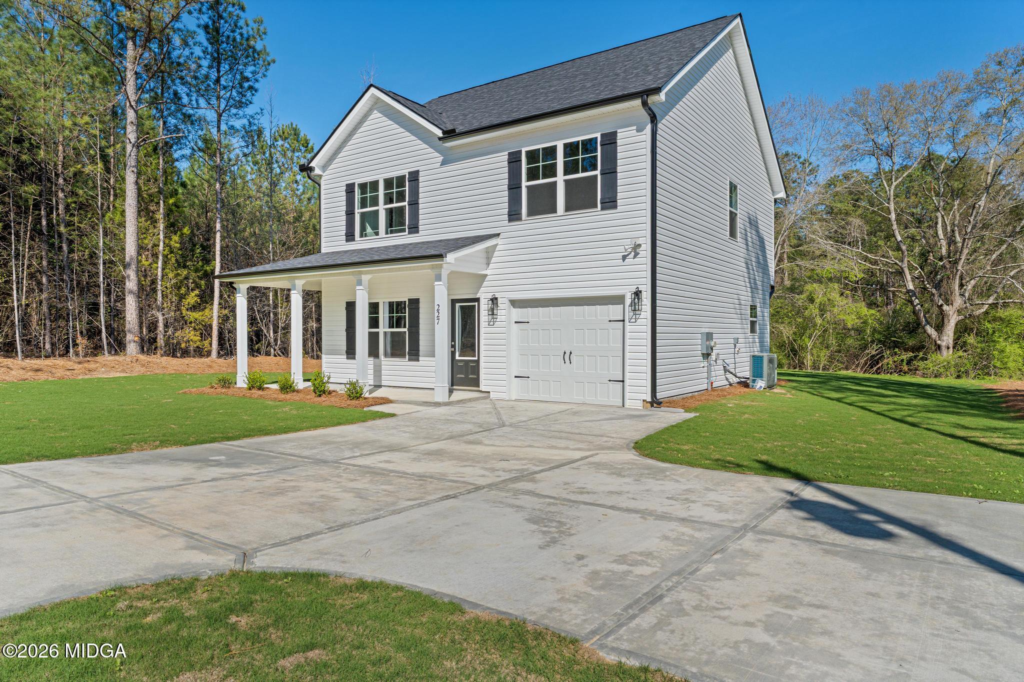 220 Welsh Trail Macon, GA 31216 - Photo 2 of 30 front view of a house with a yard