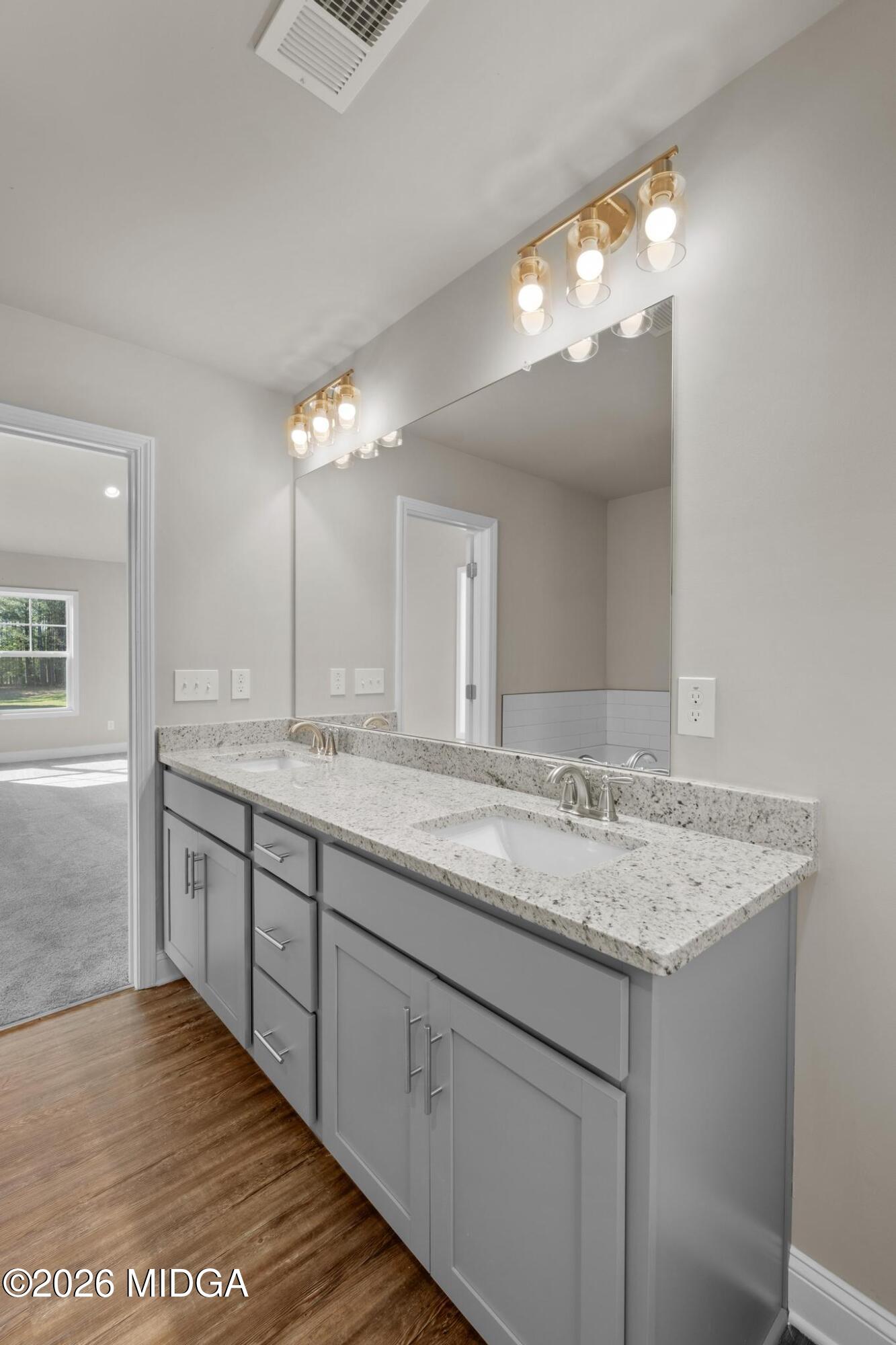 220 Welsh Trail Macon, GA 31216 - Photo 22 of 30 a bathroom with a sink and a mirror