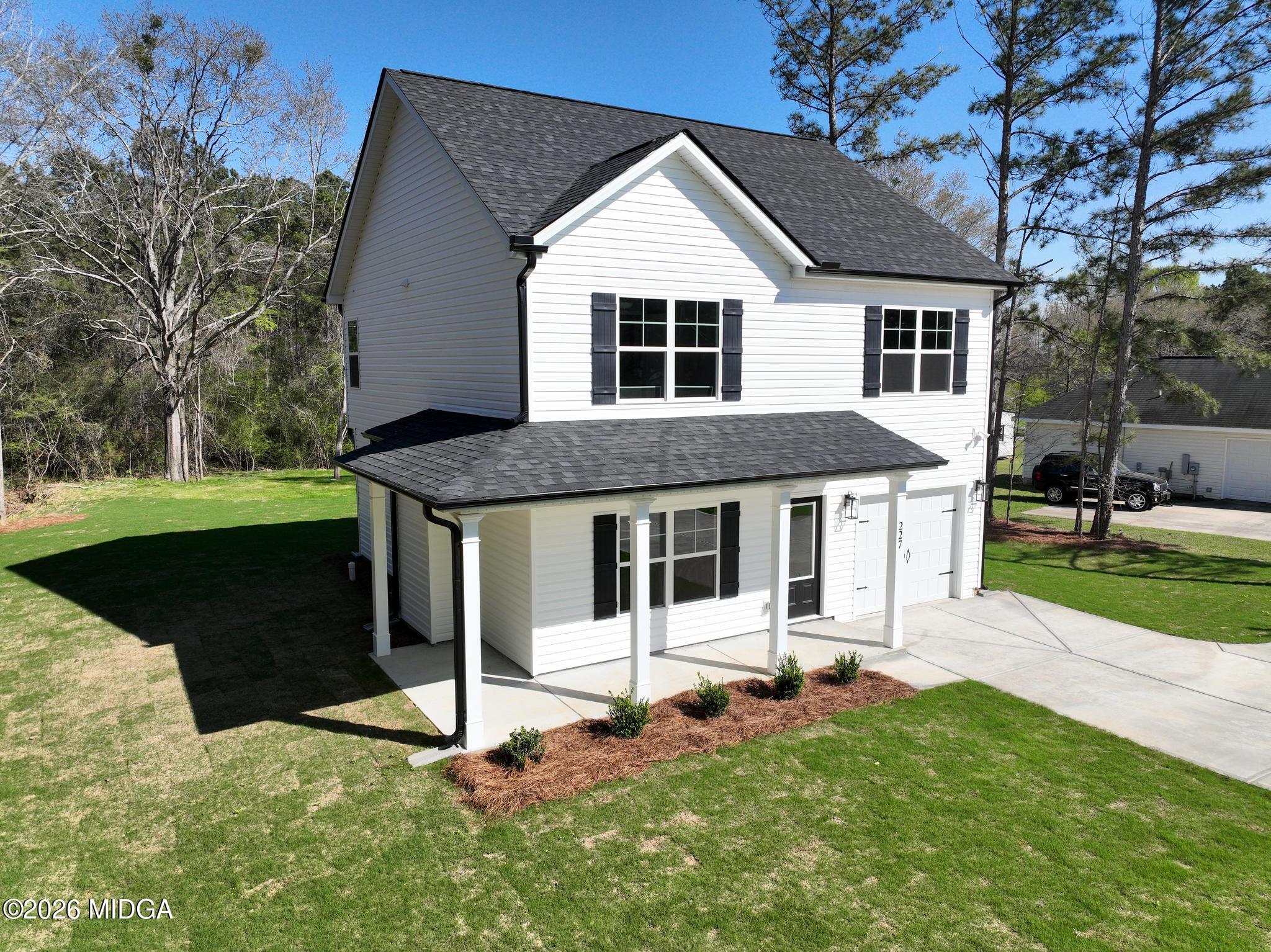220 Welsh Trail Macon, GA 31216 - Photo 4 of 30 a front view of a house with a yard