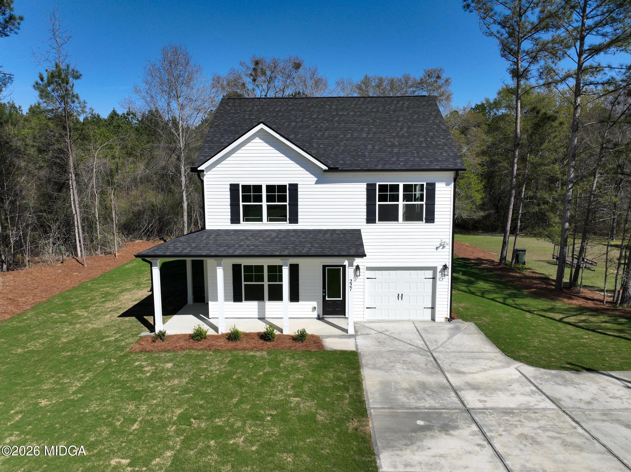 220 Welsh Trail Macon, GA 31216 - Photo 5 of 30 a front view of a house with a yard