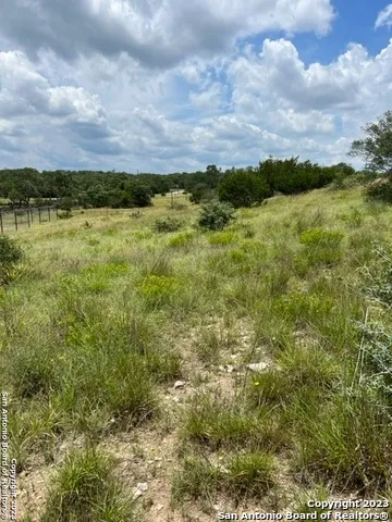 a view of a lake with houses in the back
