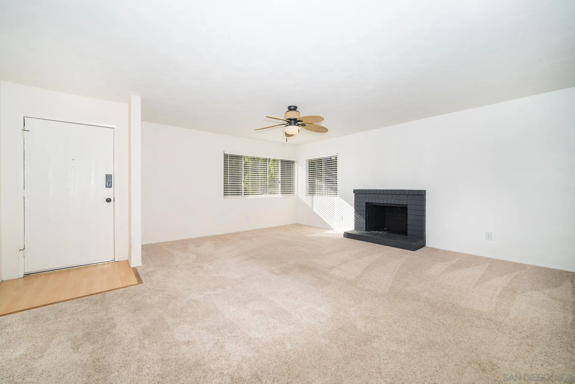 10134 Princess Joann Road Santee, CA 92071 - Photo 7 of 29 an empty room with windows and fireplace