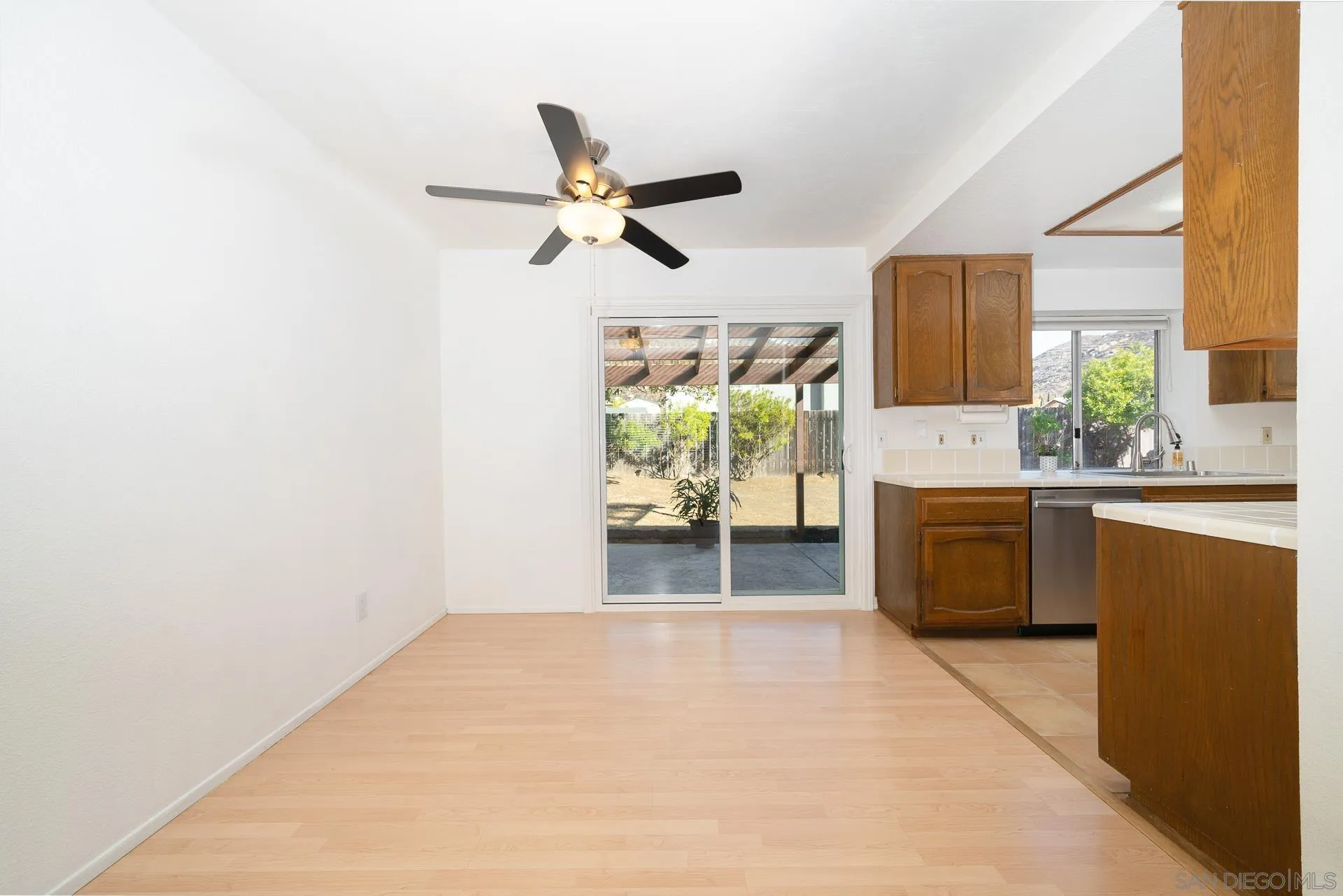 10134 Princess Joann Road Santee, CA 92071 - Photo 10 of 29 a kitchen with kitchen island a stove a sink and a refrigerator