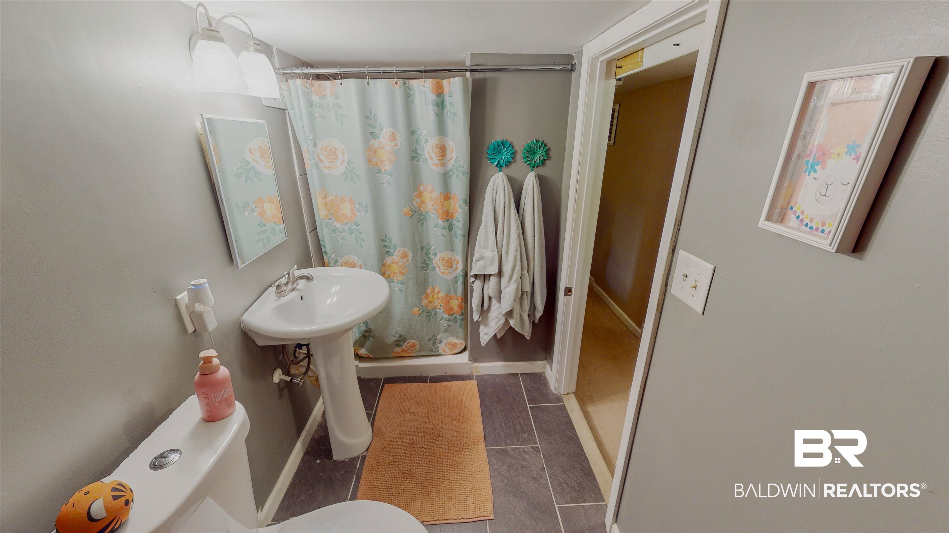 19365 Keller Road Foley, AL 36535 - Photo 25 of 41 Bathroom featuring a shower with curtain