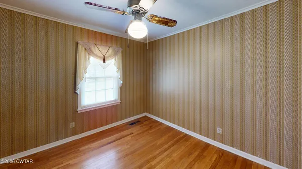 a view of a room with a ceiling fan