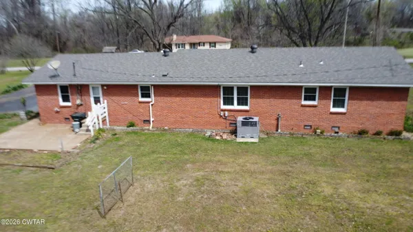 an aerial view of residential house with outdoor space