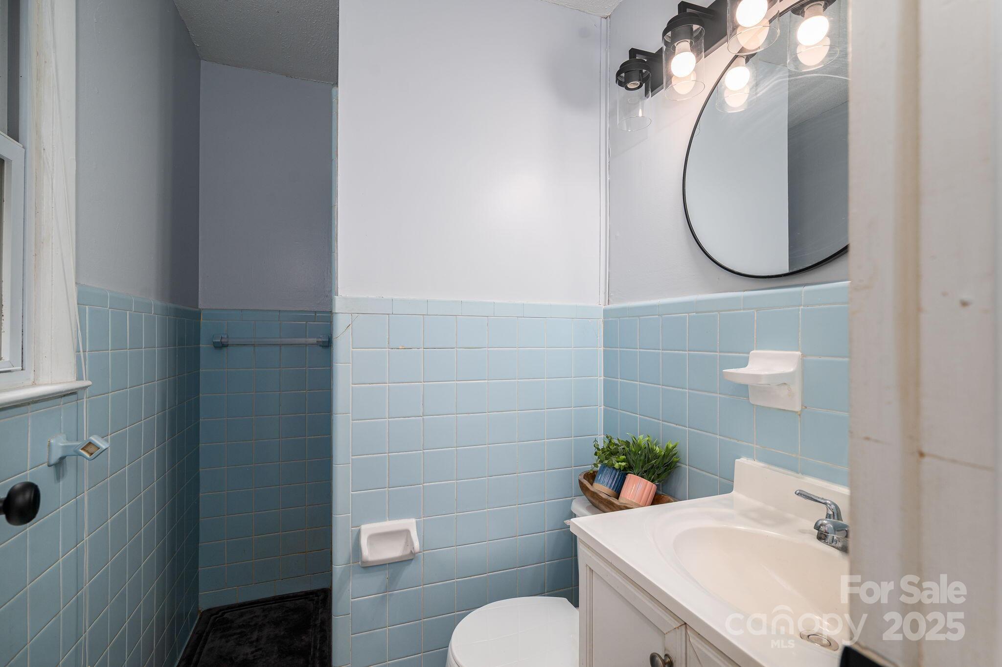 26 Kee Road Belmont, NC 28012 - Photo 11 of 15 a bathroom with a sink toilet and a mirror