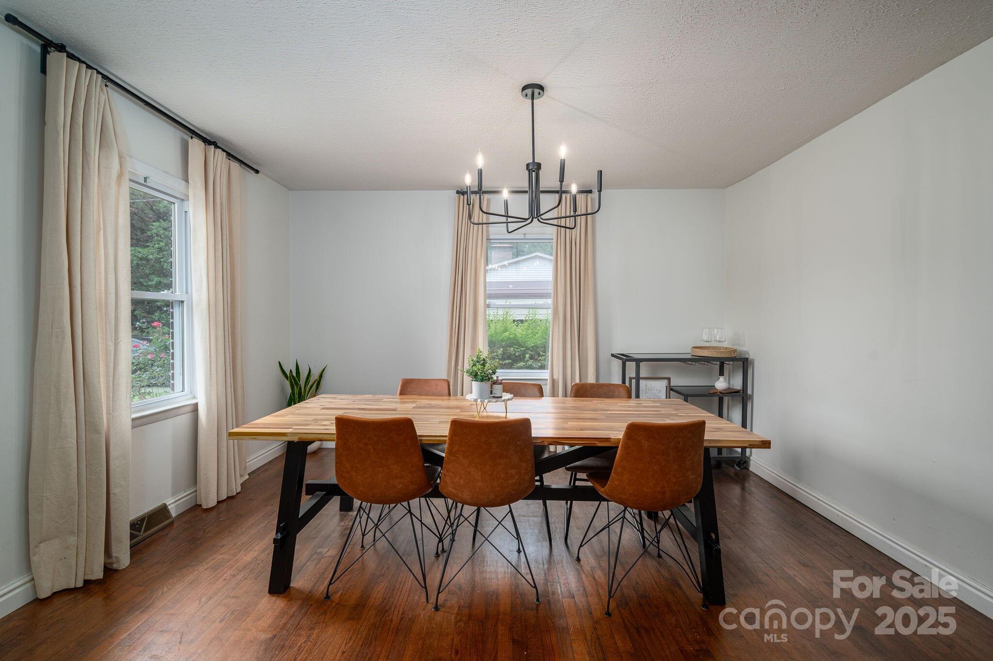 26 Kee Road Belmont, NC 28012 - Photo 8 of 15 a view of a dining room with furniture window and wooden floor