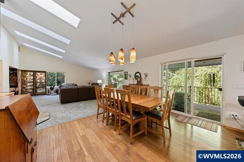6100 Teal Creek Road Dallas, OR 97338 - Photo 9 of 41 a view of a dining room with furniture window and wooden floor