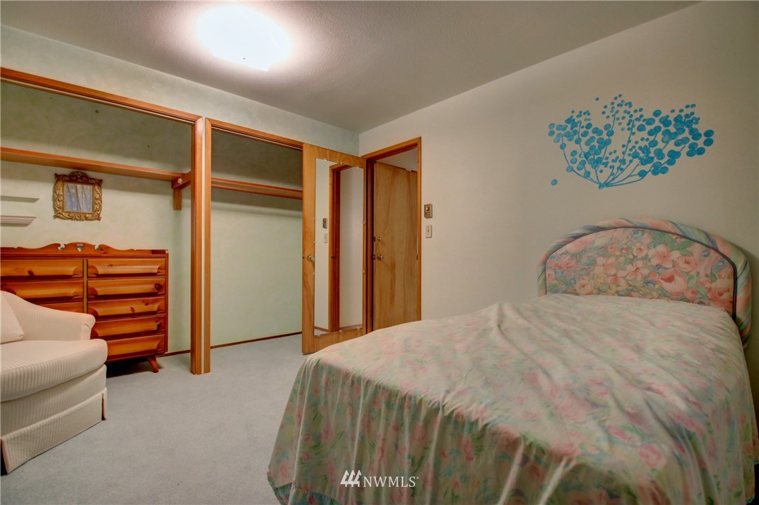 21889 Little Mountain Road Mount Vernon, WA 98274 - Photo 19 of 31 a bedroom with a bed and a closet