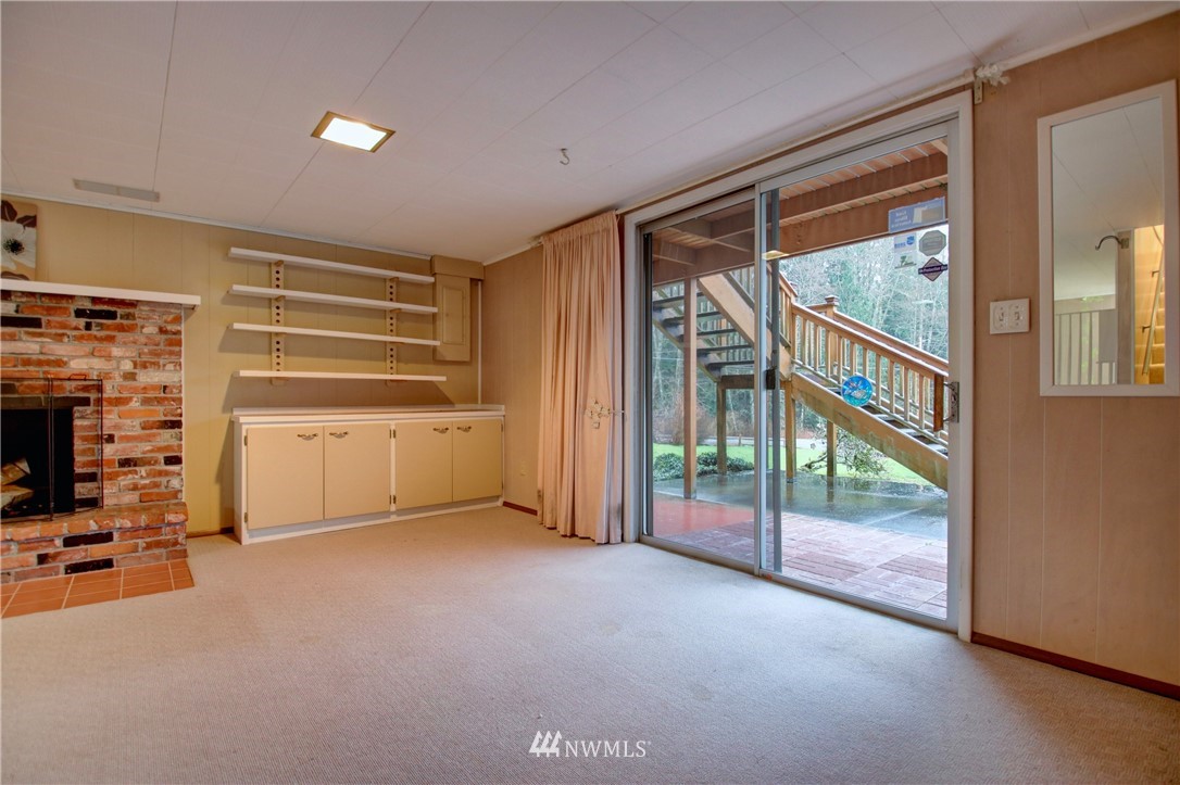 21889 Little Mountain Road Mount Vernon, WA 98274 - Photo 20 of 31 a view of an empty room with a fireplace and a window