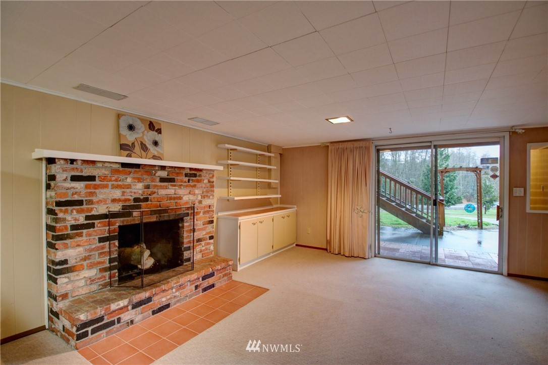 21889 Little Mountain Road Mount Vernon, WA 98274 - Photo 23 of 31 a view of an empty room with a fireplace