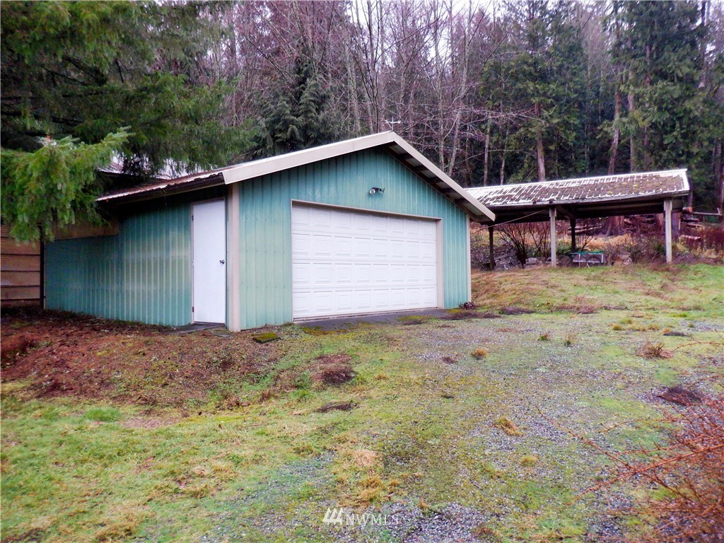 21889 Little Mountain Road Mount Vernon, WA 98274 - Photo 3 of 31 a backyard of a house with lots of green space